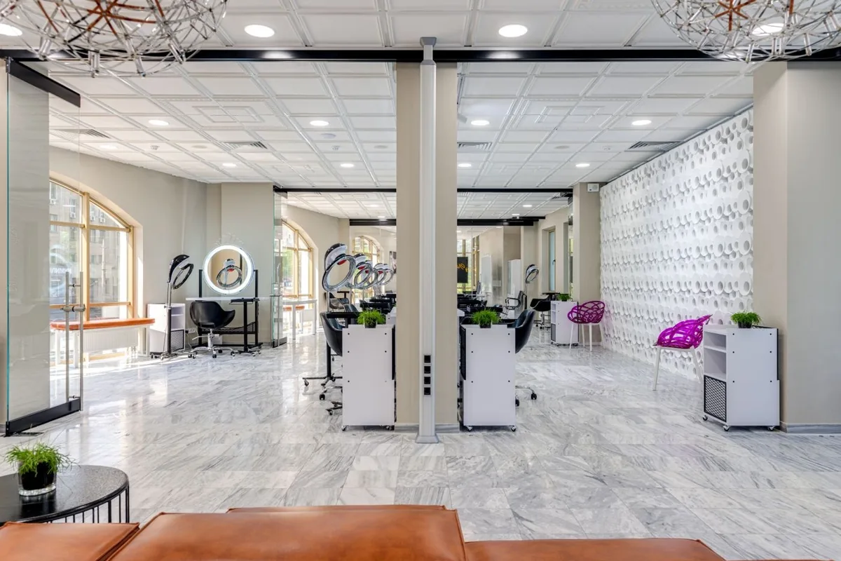 Bright salon interior with styling chairs and mirrors.